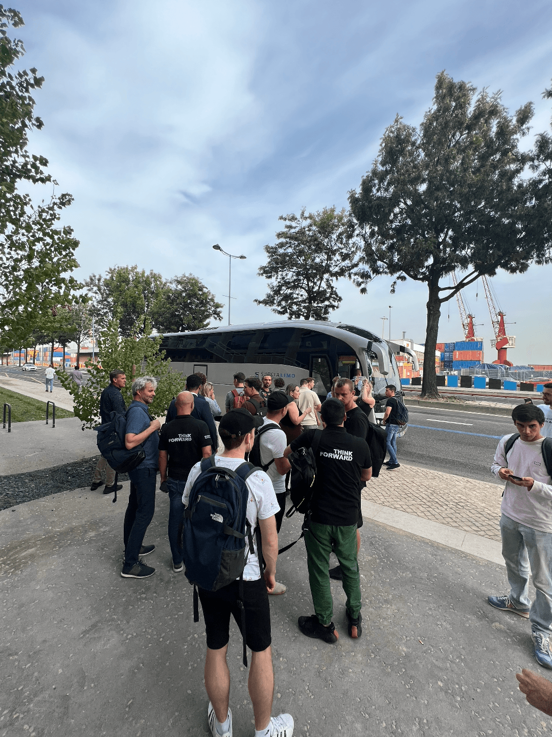 People getting ready to get on a bus at a BCNL blockchain event