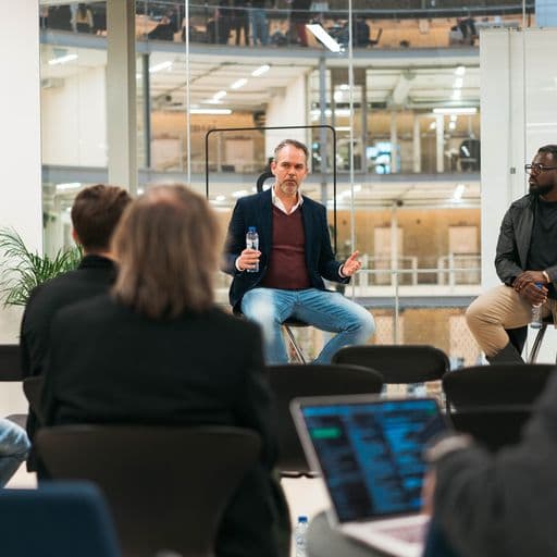 Presenter sitting and talking at a BCNL event